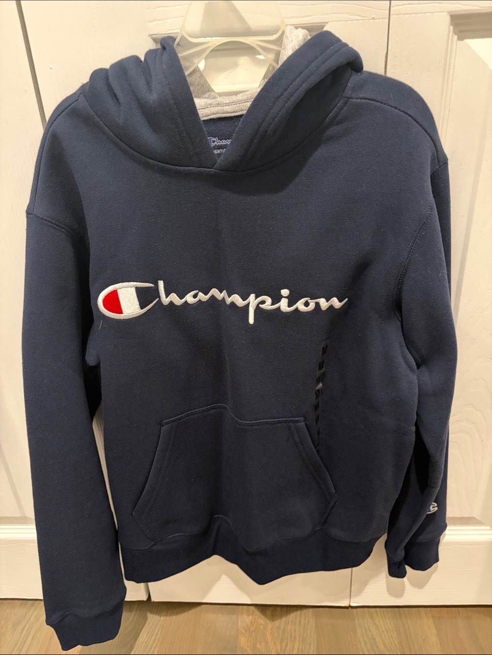 Boys champion hooded sweatshirt size medium navy blue with grey inside hood